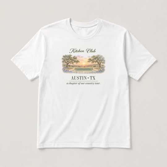 White t-shirt with a graphic design and text on a light gray background